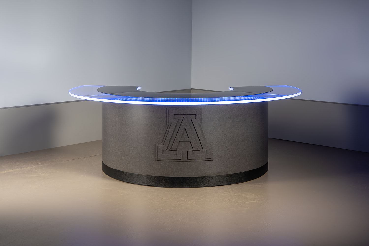 Custom round desk with topographic logo and RGBW edgelighting