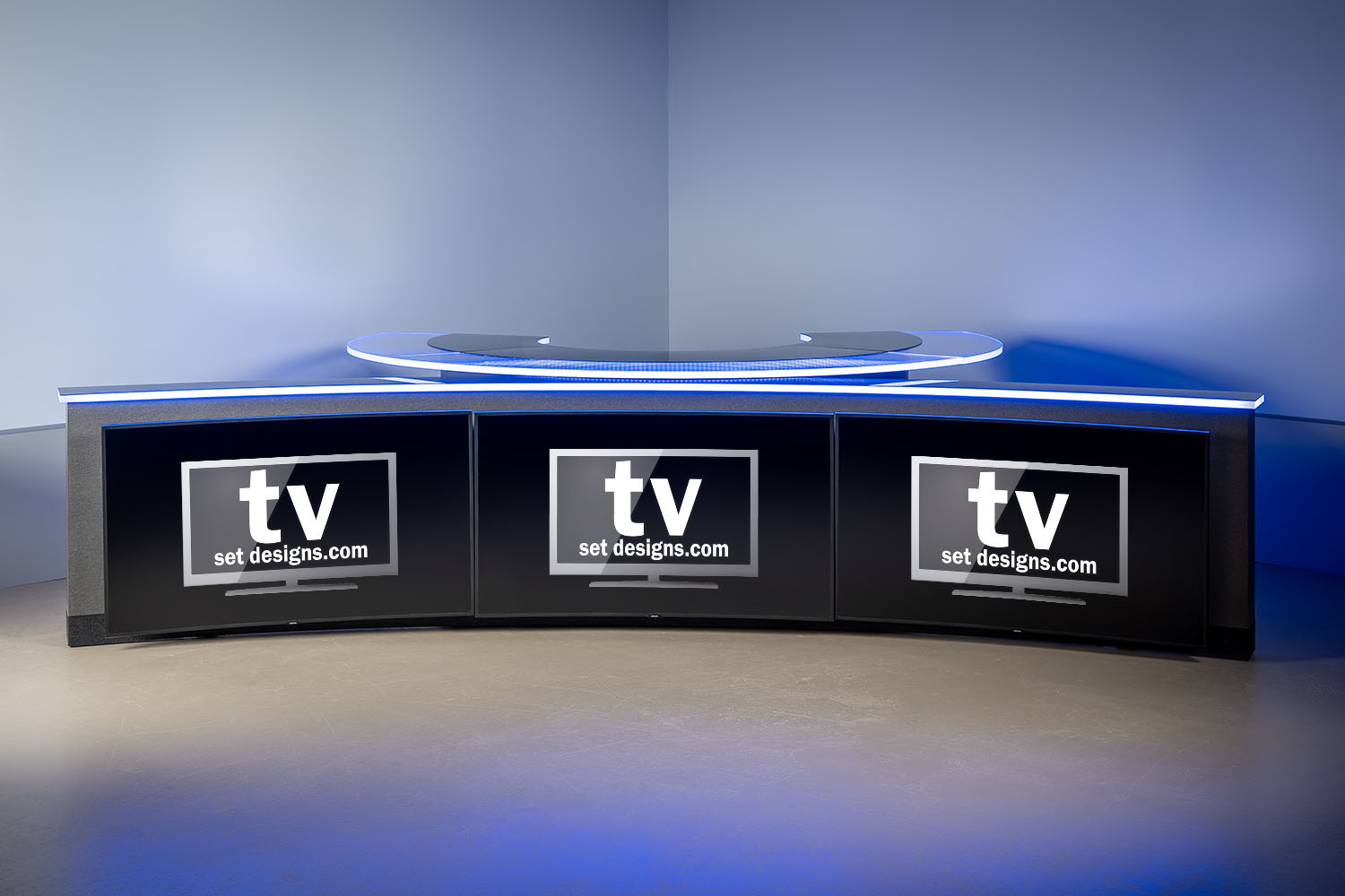 Custom round desk with three monitor knee wall with RGBW edge lighting